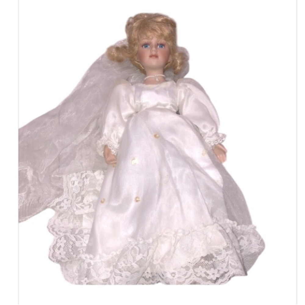 Porcelain doll in wedding dress blonde hair